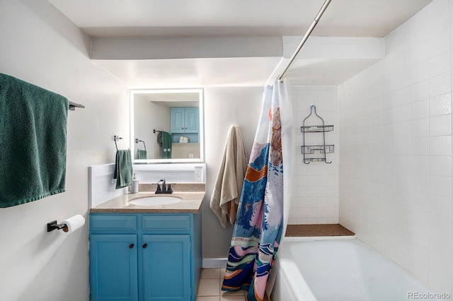 full bath with shower / bath combo with shower curtain, tile patterned flooring, and vanity
