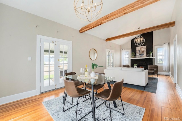 5326 Lowell Blvd, Denver, CO 80221 - dining room with a chandelier, french doors, light wood-type flooring, and baseboards