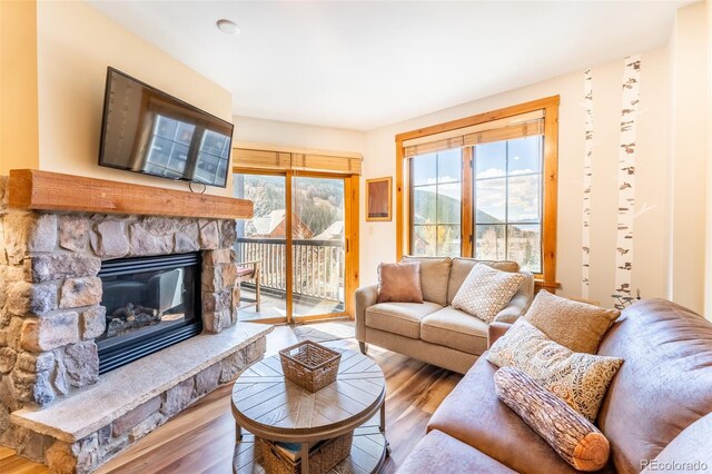 150 Dercum Sq Unit 8501, Keystone, CO 80435 - living area with a fireplace and wood finished floors