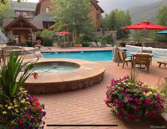 150 Dercum Sq Unit 8501, Keystone, CO 80435 - community pool featuring a hot tub and a patio area