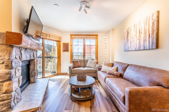 150 Dercum Sq Unit 8501, Keystone, CO 80435 - living area with a fireplace and wood finished floors