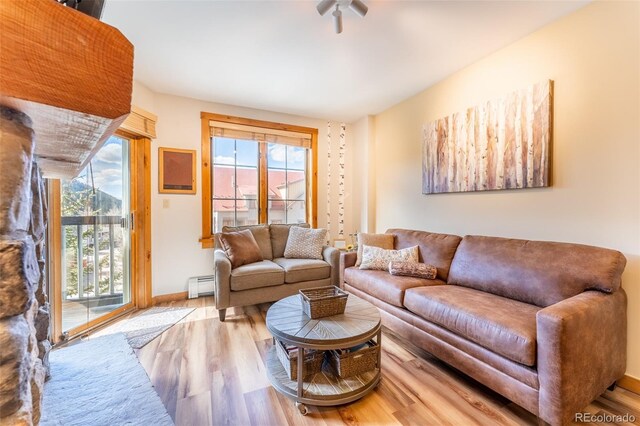 150 Dercum Sq Unit 8501, Keystone, CO 80435 - living area with wood finished floors, baseboards, and baseboard heating