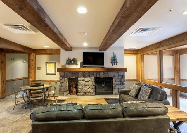 150 Dercum Sq Unit 8501, Keystone, CO 80435 - living area with visible vents, recessed lighting, beamed ceiling, and a stone fireplace