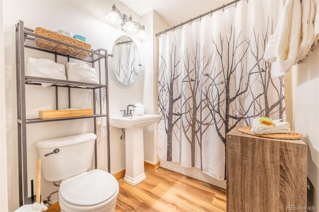 150 Dercum Sq Unit 8501, Keystone, CO 80435 - full bathroom with toilet, wood finished floors, baseboards, and shower / bath combo with shower curtain