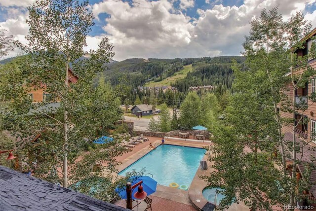150 Dercum Sq Unit 8501, Keystone, CO 80435 - pool featuring a patio and a forest view