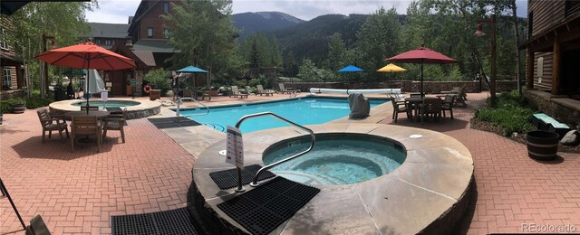150 Dercum Sq Unit 8501, Keystone, CO 80435 - community pool featuring fence, a mountain view, a community hot tub, and a patio area