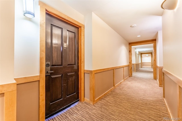 150 Dercum Sq Unit 8501, Keystone, CO 80435 - hall with wainscoting, a decorative wall, and carpet
