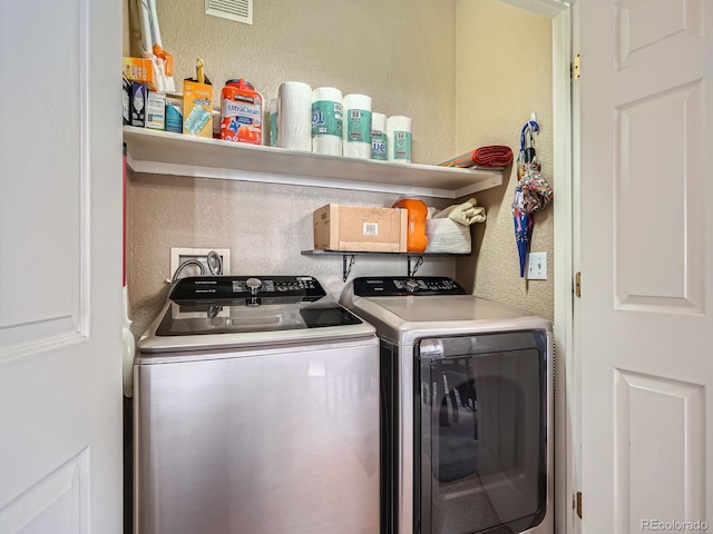 washroom featuring washer and dryer