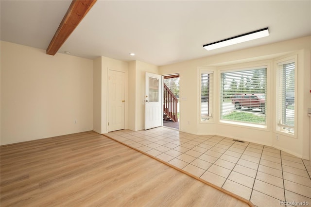 753 County Road 830 Unit 1, Fraser, CO 80442 - empty room with stairway, light wood-style floors, beamed ceiling, and recessed lighting
