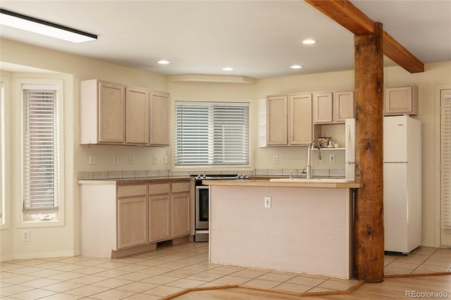 753 County Road 830 Unit 1, Fraser, CO 80442 - kitchen featuring freestanding refrigerator, stainless steel electric range oven, light tile patterned floors, light brown cabinets, and recessed lighting