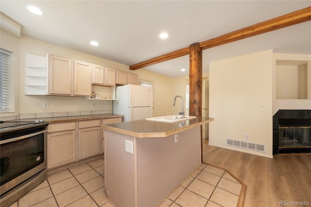 753 County Road 830 Unit 1, Fraser, CO 80442 - kitchen with freestanding refrigerator, open shelves, electric range, a sink, and recessed lighting