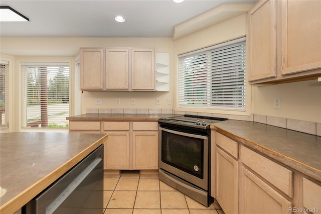 753 County Road 830 Unit 1, Fraser, CO 80442 - kitchen with appliances with stainless steel finishes, dark countertops, light tile patterned floors, light brown cabinets, and recessed lighting
