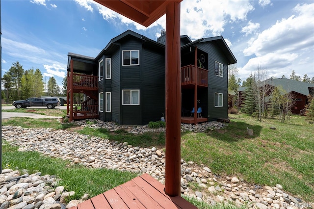 753 County Road 830 Unit 1, Fraser, CO 80442 - rear view of house with a balcony and a wooden deck