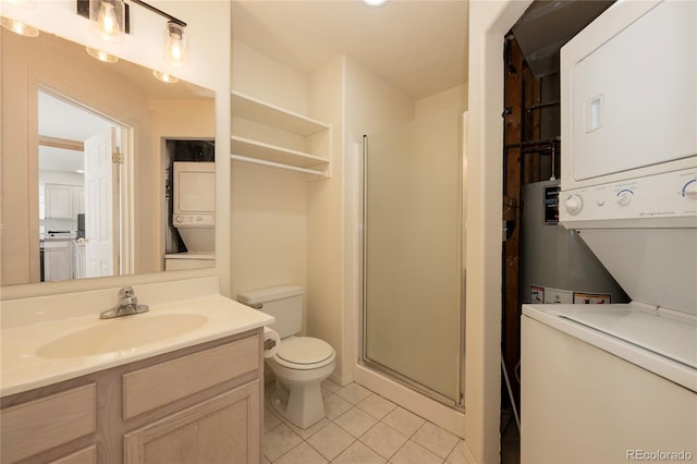753 County Road 830 Unit 1, Fraser, CO 80442 - full bath featuring stacked washer / drying machine, tile patterned flooring, vanity, toilet, and a shower stall