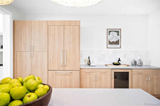 bar with backsplash, wine cooler, and light brown cabinetry