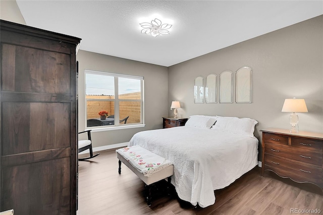 bedroom with wood-type flooring