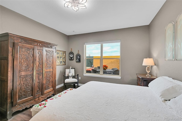 bedroom with wood-type flooring