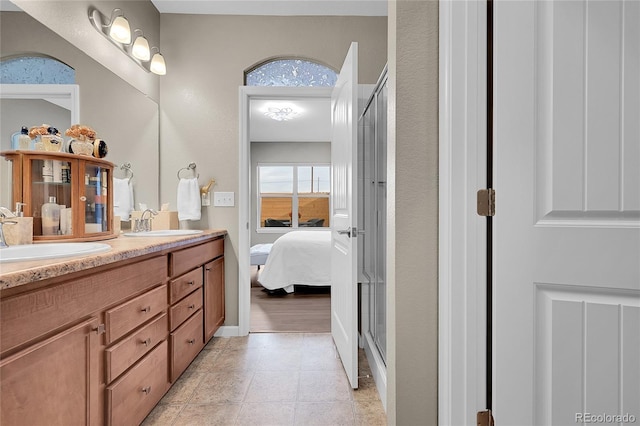 bathroom with vanity and walk in shower