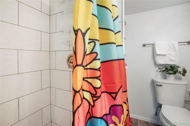 517 Canon Ave, Manitou Springs, CO 80829 - bathroom with curtained shower and wood finished floors