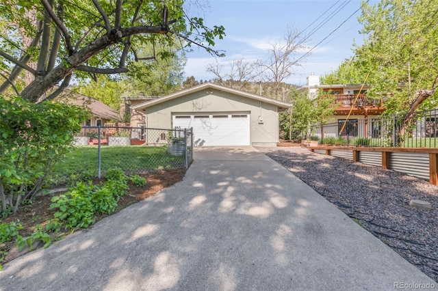 view of front of house with a garage and fence