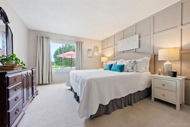 7 Shetland Ct, Highlands Ranch, CO 80130 - bedroom featuring light colored carpet and a textured ceiling