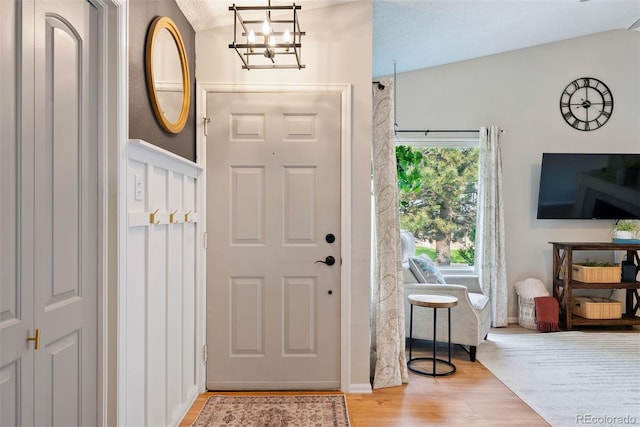 7 Shetland Ct, Highlands Ranch, CO 80130 - entrance foyer featuring a chandelier, wood finished floors, and lofted ceiling