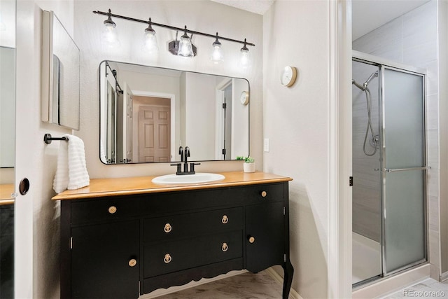 7 Shetland Ct, Highlands Ranch, CO 80130 - bathroom featuring a shower stall, vanity, and baseboards