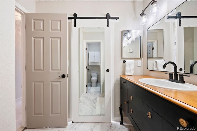 7 Shetland Ct, Highlands Ranch, CO 80130 - full bath featuring vanity, marble finish flooring, and toilet