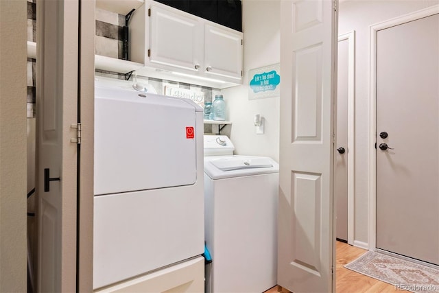 7 Shetland Ct, Highlands Ranch, CO 80130 - laundry room featuring cabinet space, light wood finished floors, and independent washer and dryer