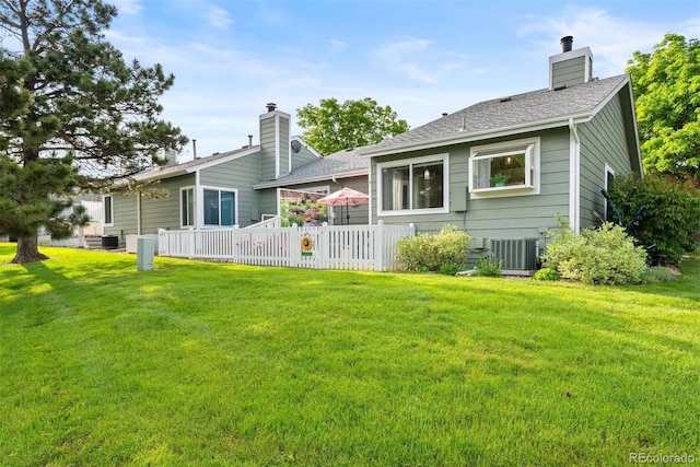 7 Shetland Ct, Highlands Ranch, CO 80130 - back of property featuring a chimney and central air condition unit