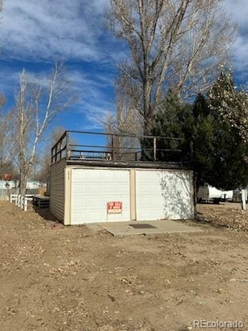 view of outbuilding with a garage