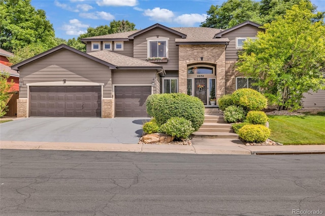 9856 Glenstone Trl, Highlands Ranch, CO 80130 - view of front facade with brick siding, an attached garage, concrete driveway, and a shingled roof