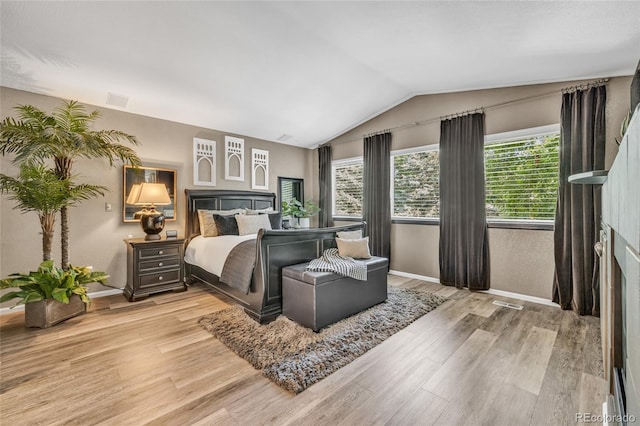 9856 Glenstone Trl, Highlands Ranch, CO 80130 - bedroom featuring light wood-type flooring and vaulted ceiling