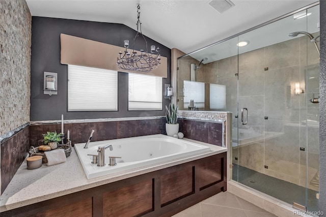 9856 Glenstone Trl, Highlands Ranch, CO 80130 - full bathroom featuring tile patterned flooring, vaulted ceiling, a jetted tub, a shower stall, and a chandelier
