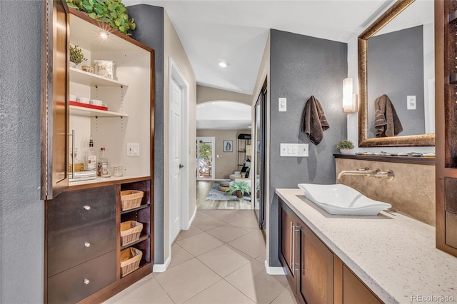 9856 Glenstone Trl, Highlands Ranch, CO 80130 - full bath featuring tile patterned floors, a textured wall, and vanity