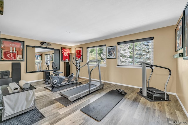 9856 Glenstone Trl, Highlands Ranch, CO 80130 - workout area featuring wood finished floors and baseboards