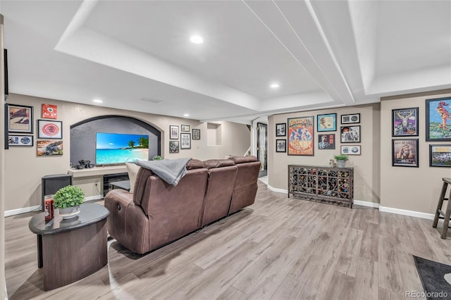 9856 Glenstone Trl, Highlands Ranch, CO 80130 - living area with light wood-type flooring, a raised ceiling, recessed lighting, and wine cooler