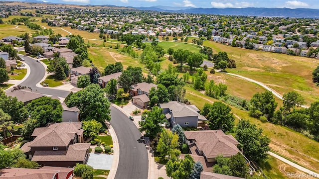 9856 Glenstone Trl, Highlands Ranch, CO 80130 - aerial perspective of suburban area with a mountainous background