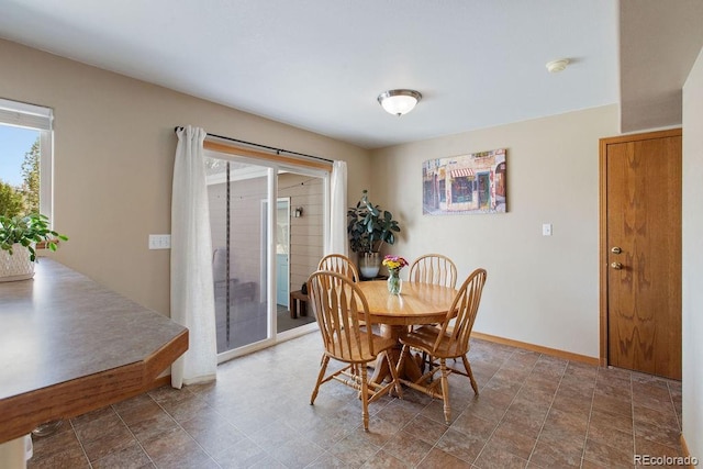 1275 W 50th St, Loveland, CO 80538 - dining space featuring baseboards