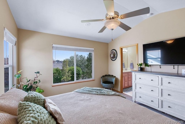 1275 W 50th St, Loveland, CO 80538 - bedroom with lofted ceiling, multiple windows, carpet floors, ensuite bath, and ceiling fan