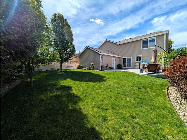 1275 W 50th St, Loveland, CO 80538 - rear view of house featuring a patio