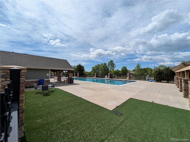 1275 W 50th St, Loveland, CO 80538 - community pool featuring a patio area