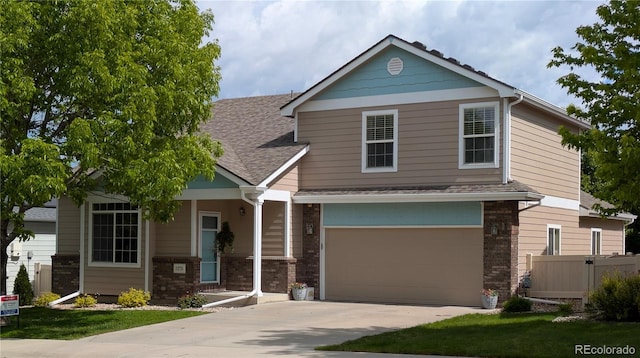 1275 W 50th St, Loveland, CO 80538 - view of front of property with concrete driveway, an attached garage, brick siding, and roof with shingles