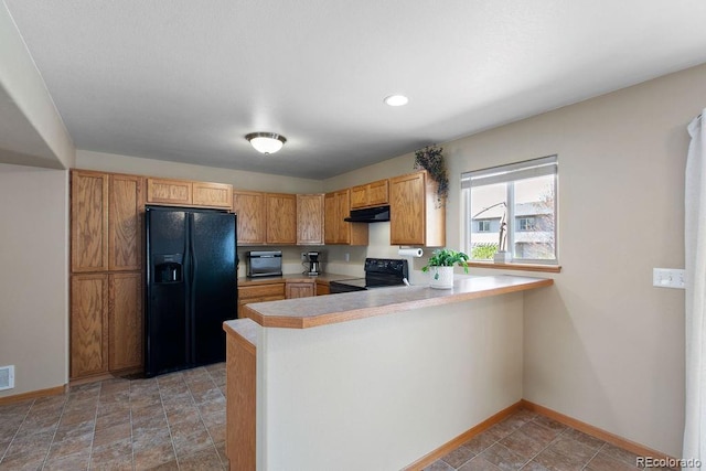 1275 W 50th St, Loveland, CO 80538 - kitchen featuring black appliances, under cabinet range hood, a peninsula, baseboards, and light countertops