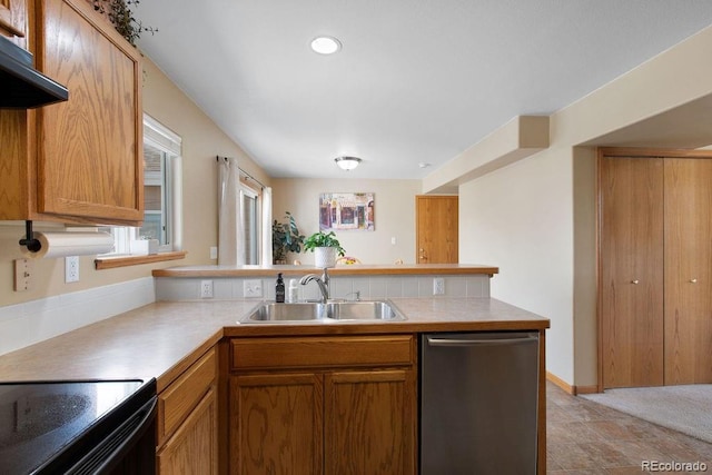 1275 W 50th St, Loveland, CO 80538 - kitchen with stainless steel dishwasher, a peninsula, a sink, and light countertops
