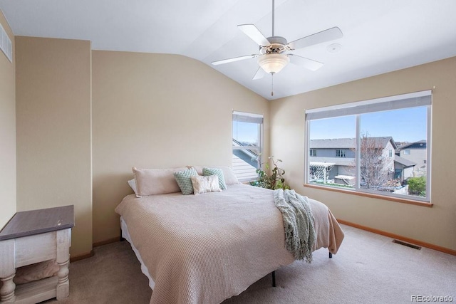 1275 W 50th St, Loveland, CO 80538 - carpeted bedroom featuring vaulted ceiling, baseboards, and a ceiling fan