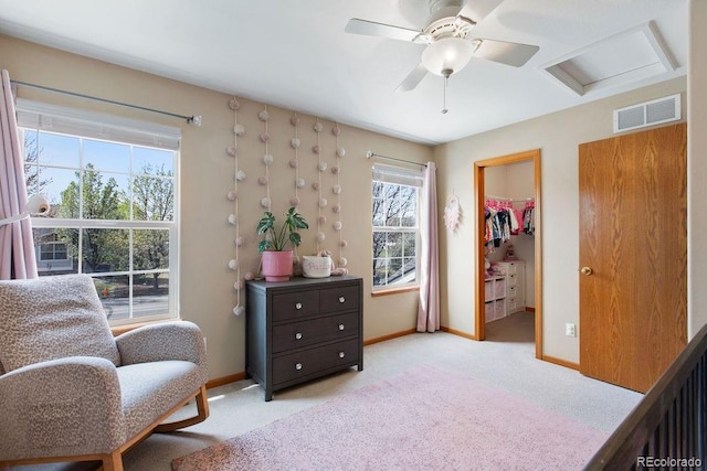 1275 W 50th St, Loveland, CO 80538 - living area featuring light colored carpet, baseboards, attic access, and ceiling fan