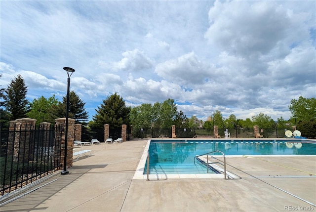 1275 W 50th St, Loveland, CO 80538 - community pool with a patio area