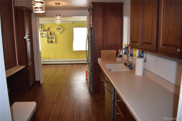 bathroom with a baseboard heating unit, wood finished floors, and a sink