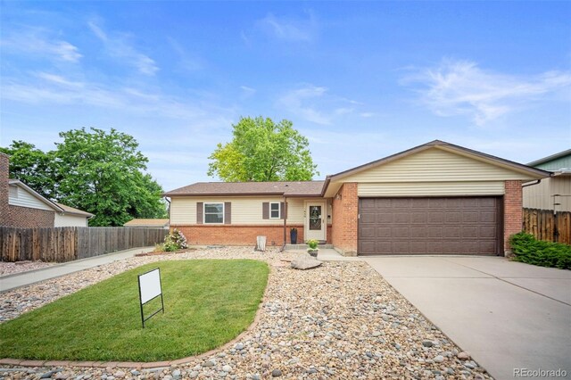 7659 S Holland Way, Littleton, CO 80128 - ranch-style home with brick siding, a garage, and driveway
